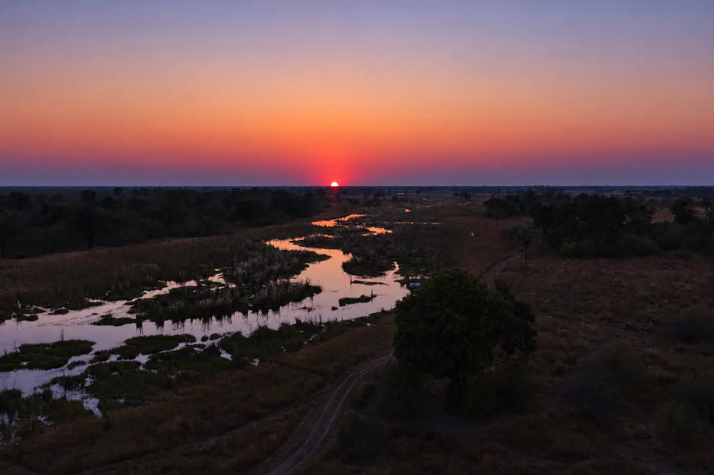 A red sunset over the channels of the Delta