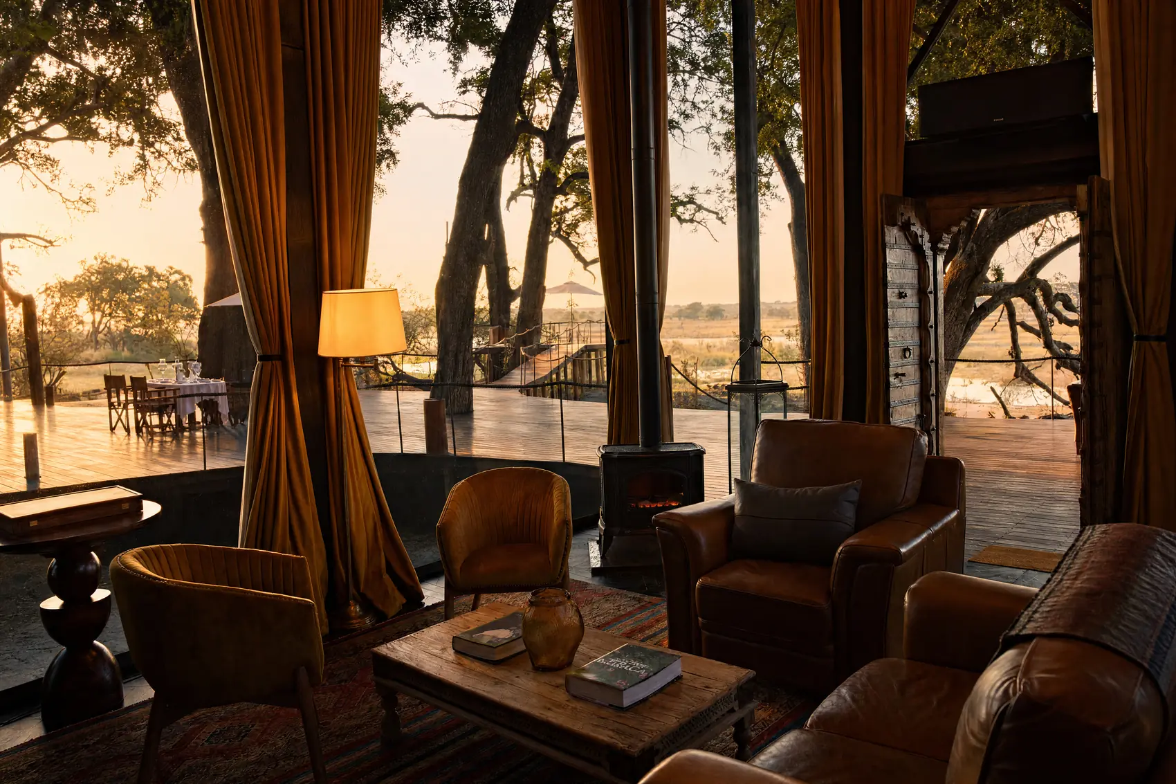 The villa lounge with the wood burner, open to the deck