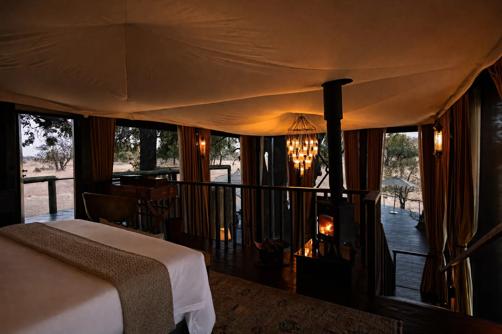 The bedroom seen from the foot of the bed, with the deck beyond